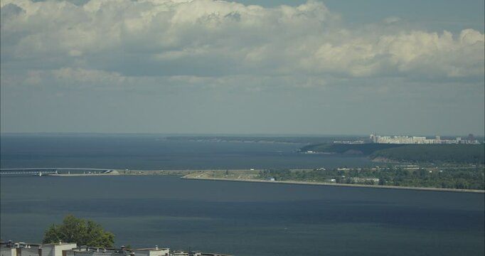 Volga river flowing through city on a cloudy day