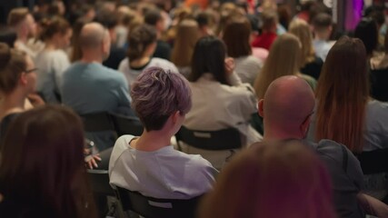 Viewers absorb self-improvement techniques, focus on violet-haired girl with short cut. workshop on enhancing creativity in personal development. Perfect for artistic self-growth, creative training