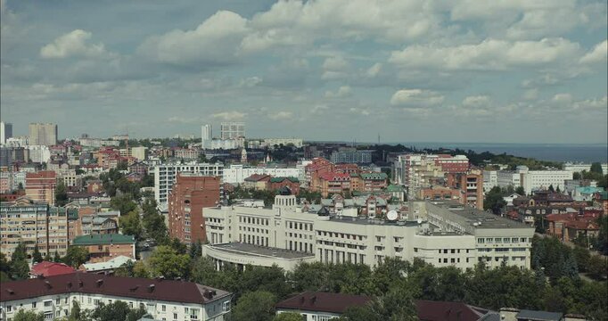 Cityscape overlooking river on a summer day