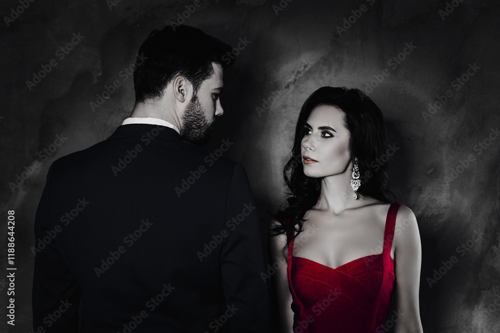 Poster rear view portrait of brunet gentleman in tuxedo and pretty lady with front view in purple outfit wi
