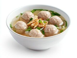 A perfectly arranged bowl of Indonesian bakso, including large beef meatballs, noodles, tofu, and a sprinkle of crispy shallots, served in a minimalist white bowl, isolated on a clean white background