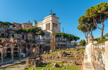 Naklejka premium ROME, ITALY. The Forum of Caesar, with the Vittorio Emanuele Monument (Vittoriano) behind. 