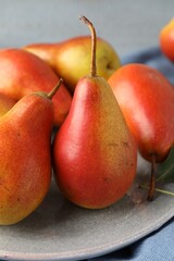 Many ripe juicy pears on table, closeup