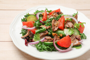 Delicious fresh tuna salad on wooden table, closeup