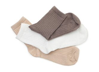 Pairs of soft socks isolated on white, top view