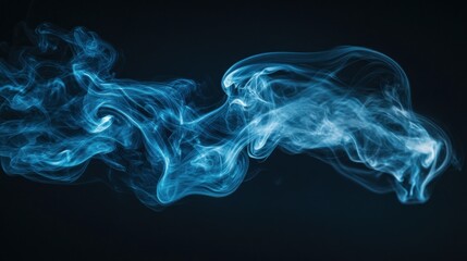 Fototapeta premium Abstract blue smoke swirls on black background.