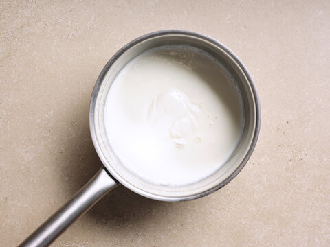 A pot shows a smooth, creamy mixture, possibly a base for Ukrainian beetroot soup. The cooking preparation highlights fresh ingredients and traditional methods used in this dish