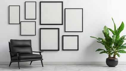 A white wall with multiple black frames on the floor