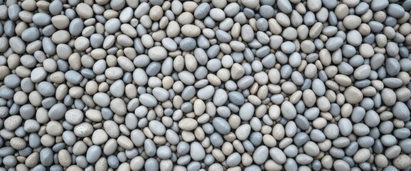 Close-up of smooth gray pebbles arranged in a natural pattern.