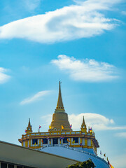 Naklejka premium Temple (Wat Phu Khao Thong), ancient art, standing tall on a mountain, located in Bangkok, Thailand.