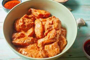 Close-up of raw marinated chicken wings, food preparation