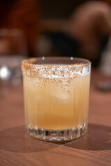 A glass of cocktail on the table