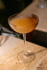 A glass of cocktail on the table