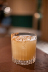 A glass of cocktail on the table