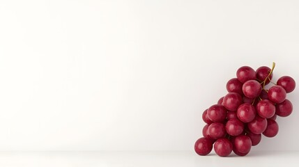 A Luscious Bunch of Bright Red Grapes on a Clean White Background