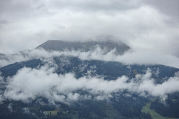 Majestic mountains enveloped in mist over Salzburg showing the beauty of nature in Austria