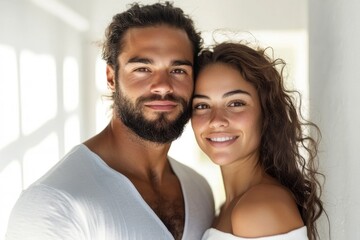 Obraz premium Couple Embracing in Minimalist White Room, Soft Gray Accents, Warm Natural Light, Intimate Atmosphere, Modern Elegance