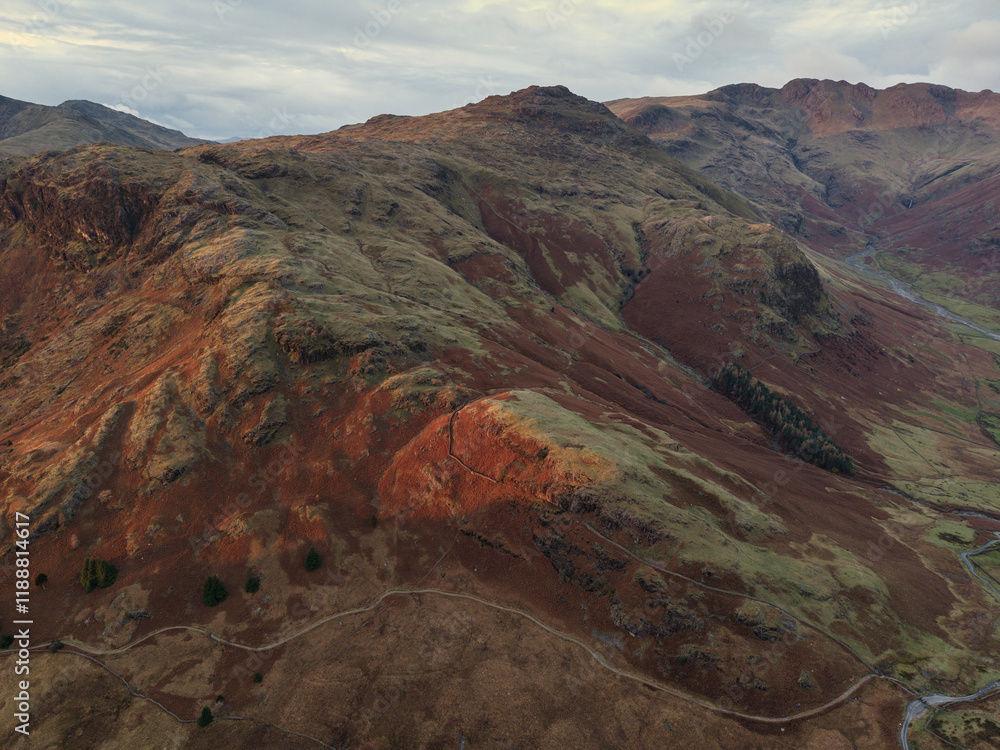 Poster Beautiful aerial drone landscape image of Blea Tarn and Langdale Valley in Lake District during vibrant Autumn sunrise