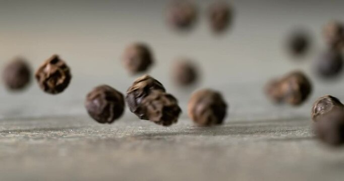 Peppercorns or black pepper spice. Super Macro Close Up. Shot on super slow motion camera 1000 fps.