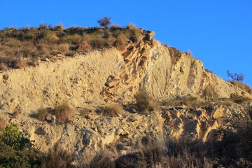 hilltop against a blue cloudless sky