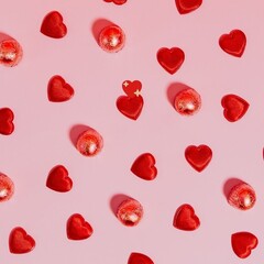 Red Hearts Background Valentine's Day candies pattern on a pink background