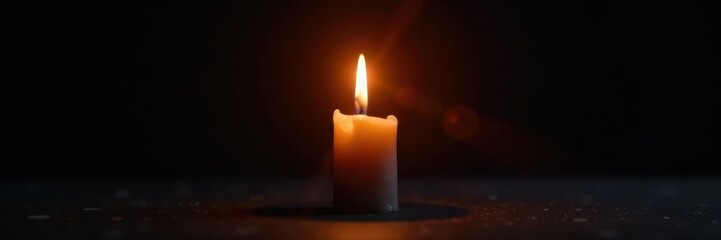 Single candle flame against black, intense light and shadow play, texture, heat