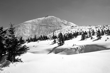 People on the trail and a tourist shelter on the top of Sniezka in the Giant Mountains