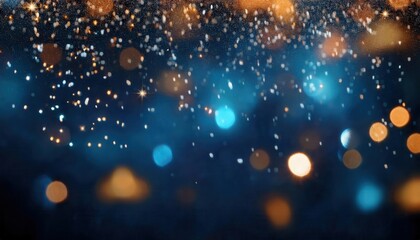 Obraz premium abstract golden and blue bokeh lights with sparkling stars on a dark background, perfect for holiday or celebration designs