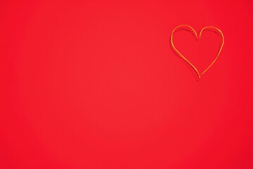 Elegant Gold Heart on Red Background