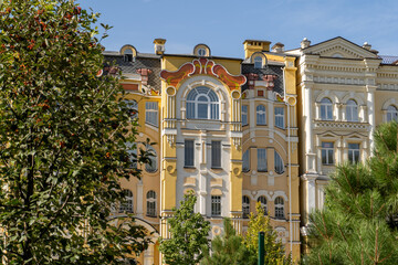 Fototapeta premium Orange yellow color modern exterior of Houses Buildings. Bright architecture street