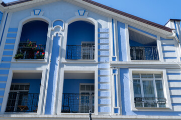 Blue color modern exterior of Houses Buildings facade balcony. Bright architecture