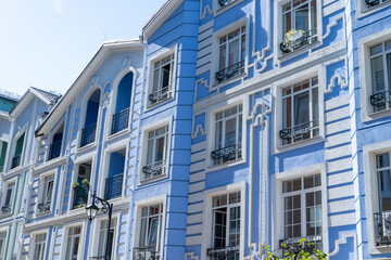 Blue color modern exterior of Houses Buildings facade. Bright architecture street