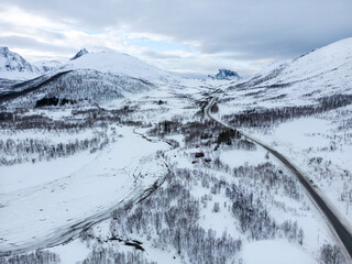Obraz premium Mountains, winter road, snow, aerial view of nature in Norway