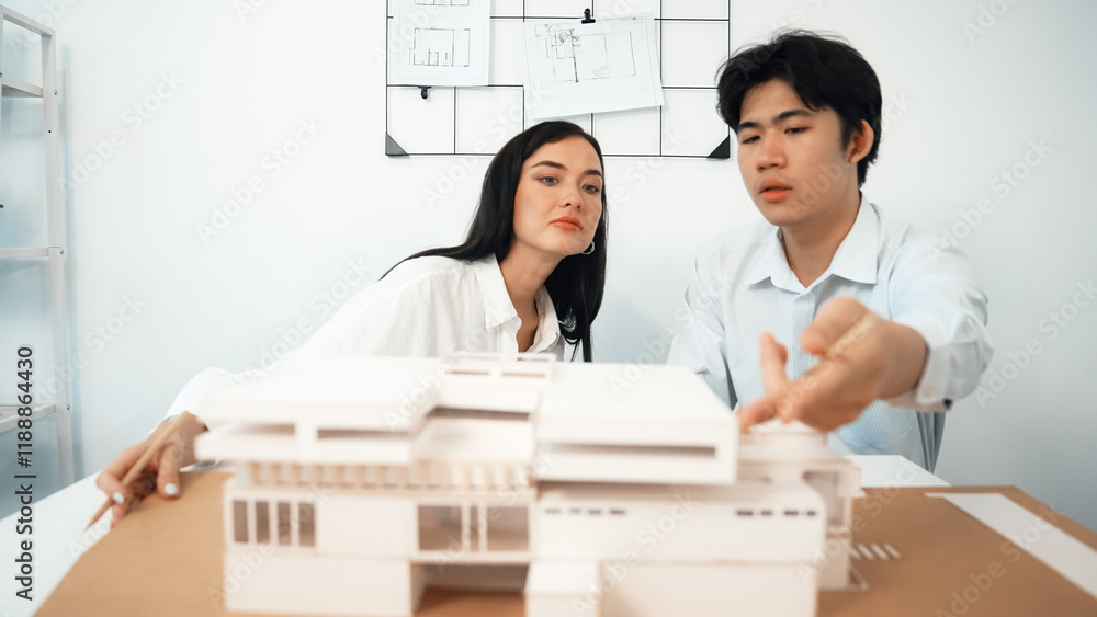 Aufkleber closeup of skilled architecture engineer team measure and decide house model while working together 