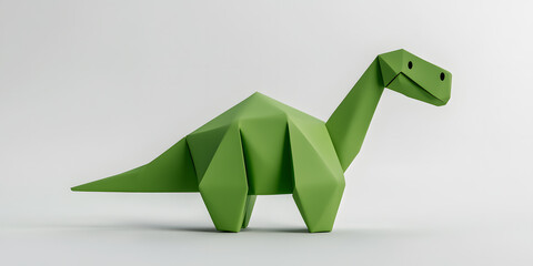 Adorable green origami dinosaur, a charming paper craft creation. Perfect for kids' room decor or educational resources.