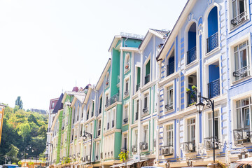 Multicolor modern exterior of Houses Buildings facade. Bright architecture street in summer. Balcony and Windows