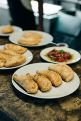 Delicious Argentine empanada with golden, crispy crust and flavorful meat filling. Perfect for illustrating Argentine cuisine.