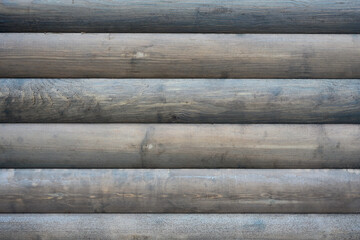 Rustic Charm of Weathered Wooden Logs: Embracing Nature's Textures and Earthy Aesthetics