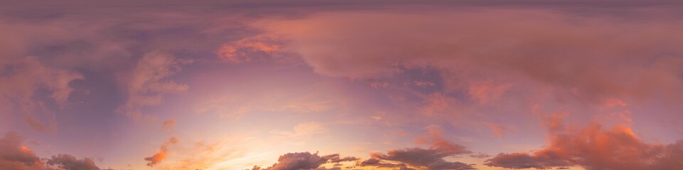 Sunset sky panorama with bright glowing pink Cumulus clouds. HDR 360 seamless spherical panorama....