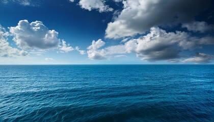 Fototapeta premium blue sea and cloudy sky over it