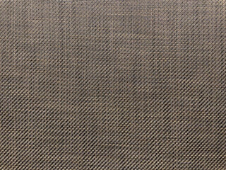 Textile pattern in brown tones with diagonal lines.