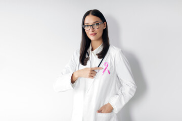 Breast Cancer Awareness. Doctor woman with pink ribbon in hospital for support people life and...
