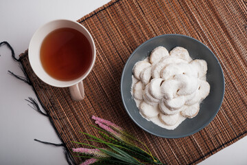 kue putri salju or princess snow cookies or snow white cookies isolated on white. popular indonesian cookies for lebaran. selected focus