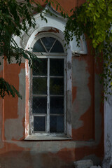 Window in a red stone house. Boguchar village