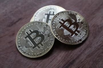 Stacks of bitcoins placed on a wooden table