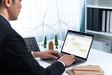 Project planning software for brisk business project management on the computer screen showing...