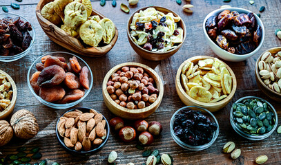 Composition with a variety of dried fruits and assorted nuts.