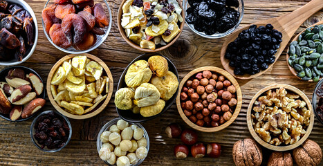 Composition with a variety of dried fruits and assorted nuts.