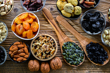 Composition with a variety of dried fruits and assorted nuts.