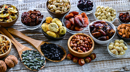 Composition with a variety of dried fruits and assorted nuts.